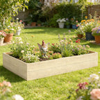 Wooden raised planter bed in a flower garden with a small angel decoration