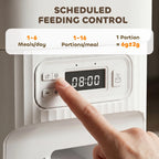 White automatic cat feeder with LCD timer screen and finger pressing control buttons