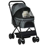 Grey pet stroller with front canopy and wheels, showing a small dog inside.
