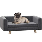Grey dog sofa bed with cushion and armrests, pug lying on it