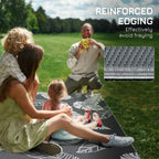 Grey-and-white leaf-pattern outdoor rug with reinforced edging, outdoors