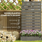 Dark grey trellis back panel with raised planter base and purple flowers below.