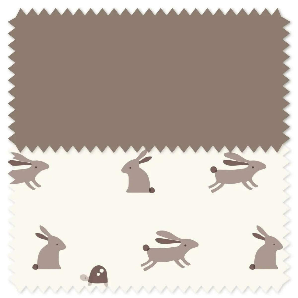 Car seat fabric swatch with white bunnies and dogs on taupe and cream background