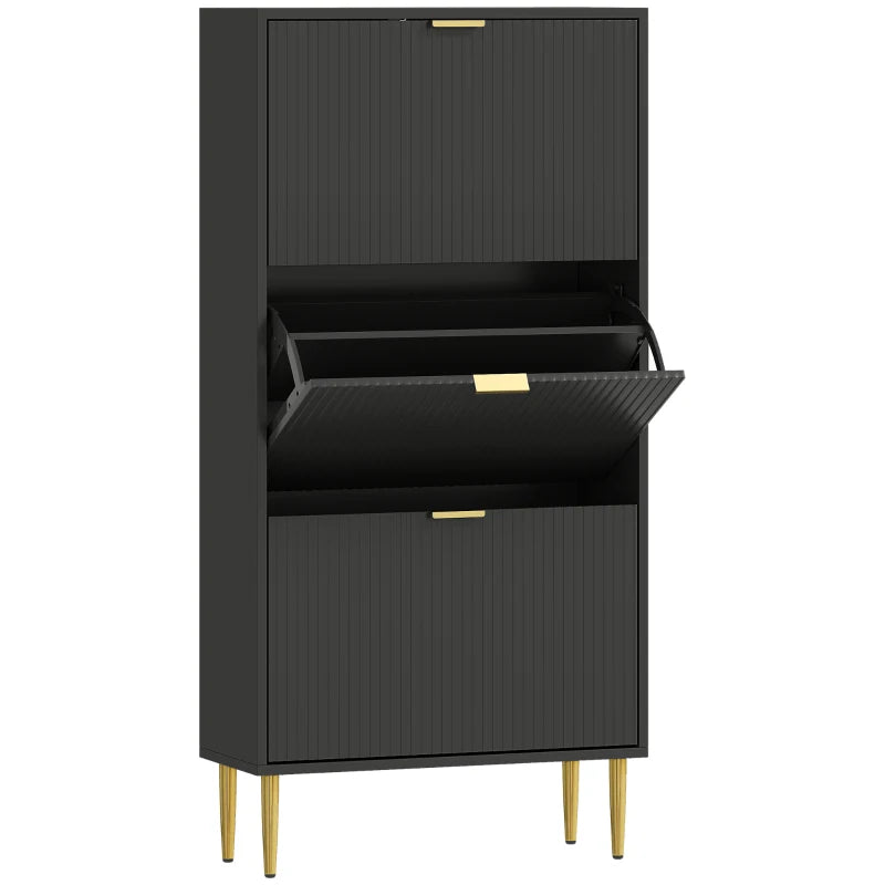 Black shoe cabinet with flip doors and three open storage compartments, gold handles.