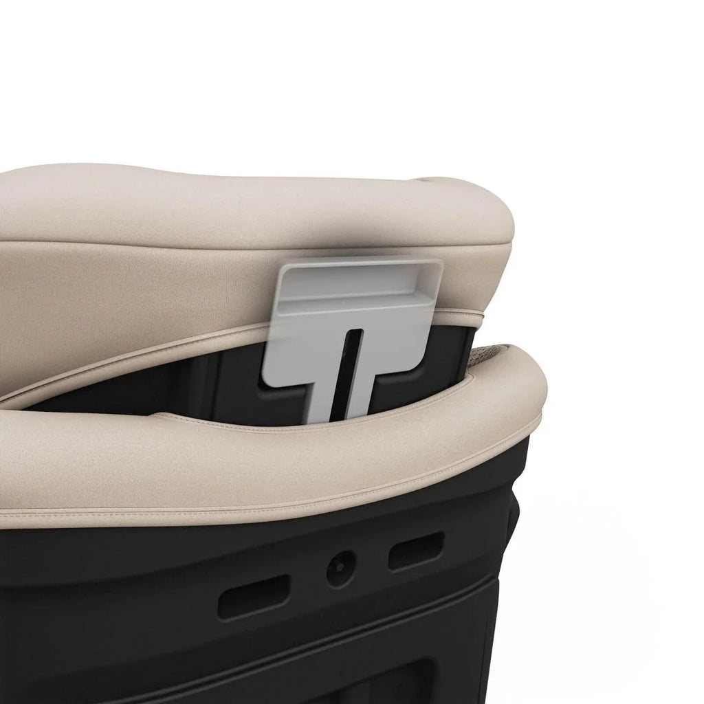 Beige car seat side armrest panel with insert and ventilation cutouts