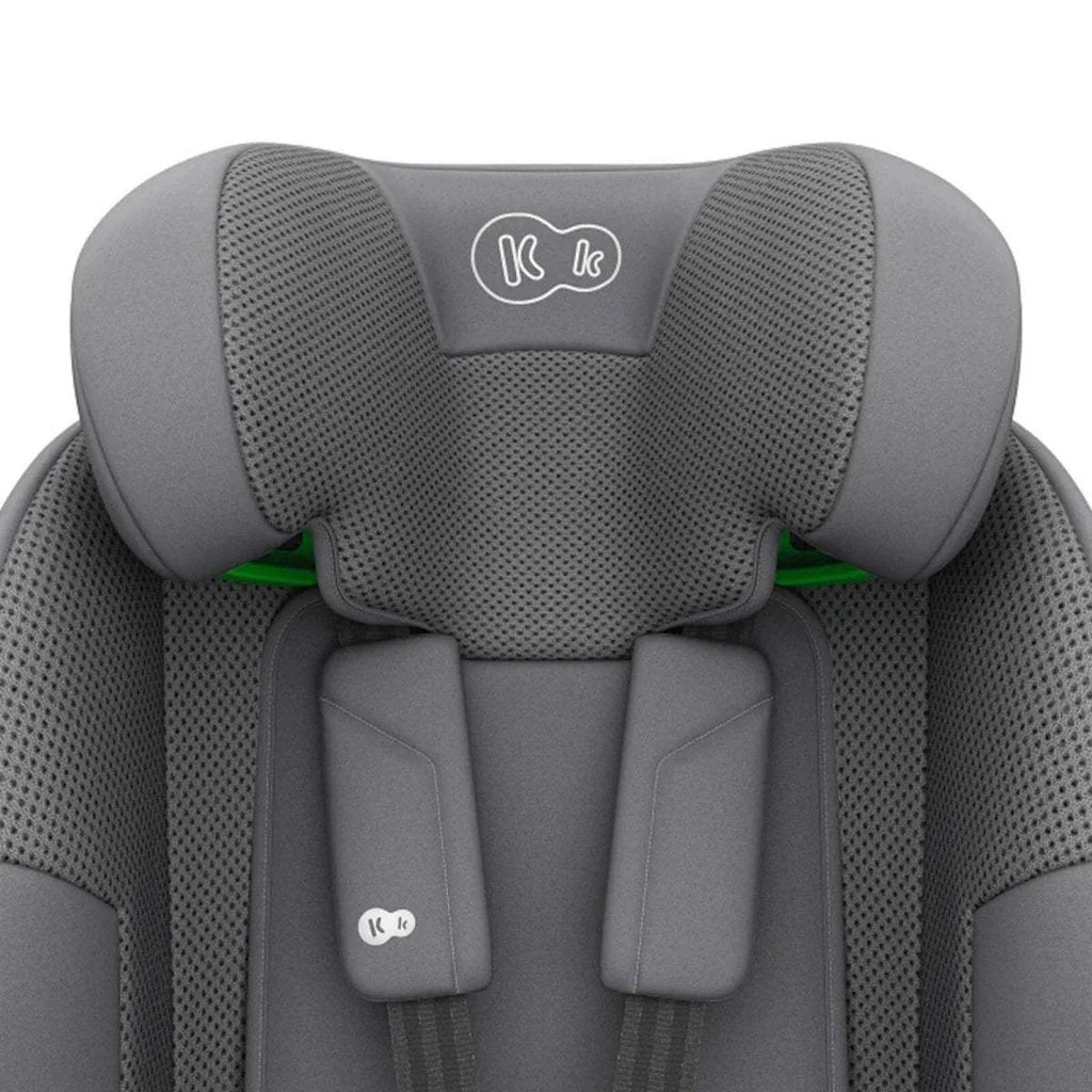 Grey car seat headrest with textured panels and padded shoulder rests