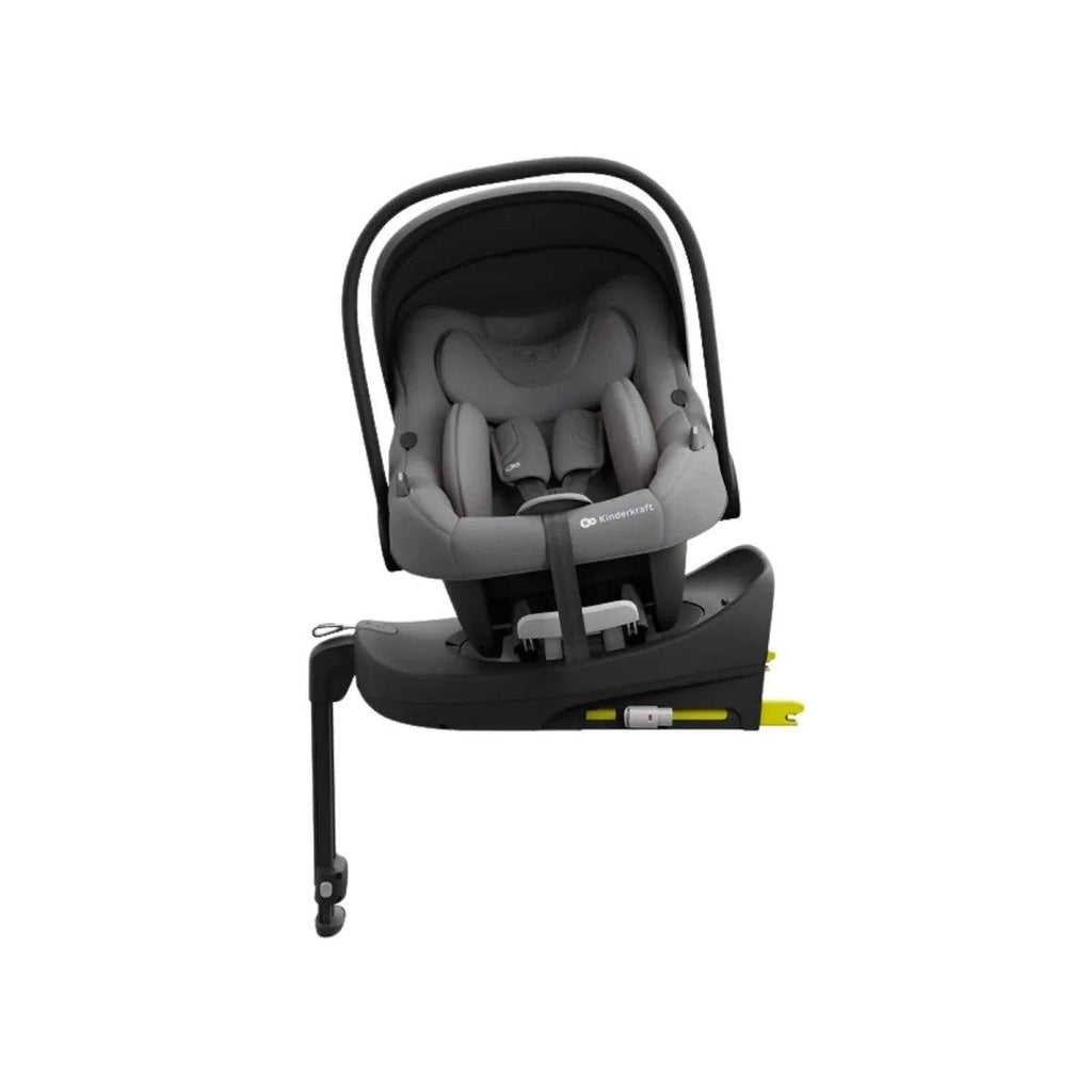Grey child car seat with canopy handle, reclined seat shell, and visible harness