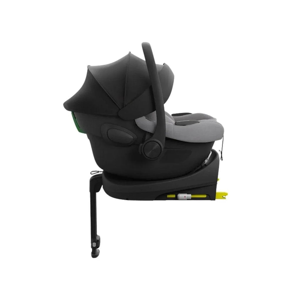 Grey child car seat in reclined position with padded headrest and side protectors