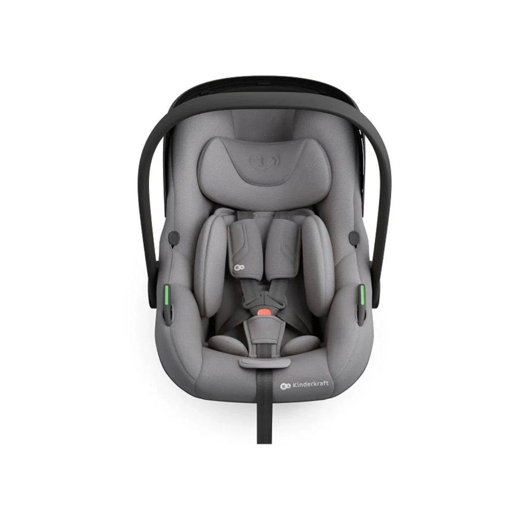 Grey child car seat shown from front view with padded inserts and shoulder straps