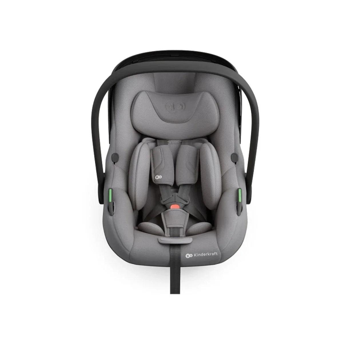 Grey child car seat shown from front view with padded inserts and shoulder straps