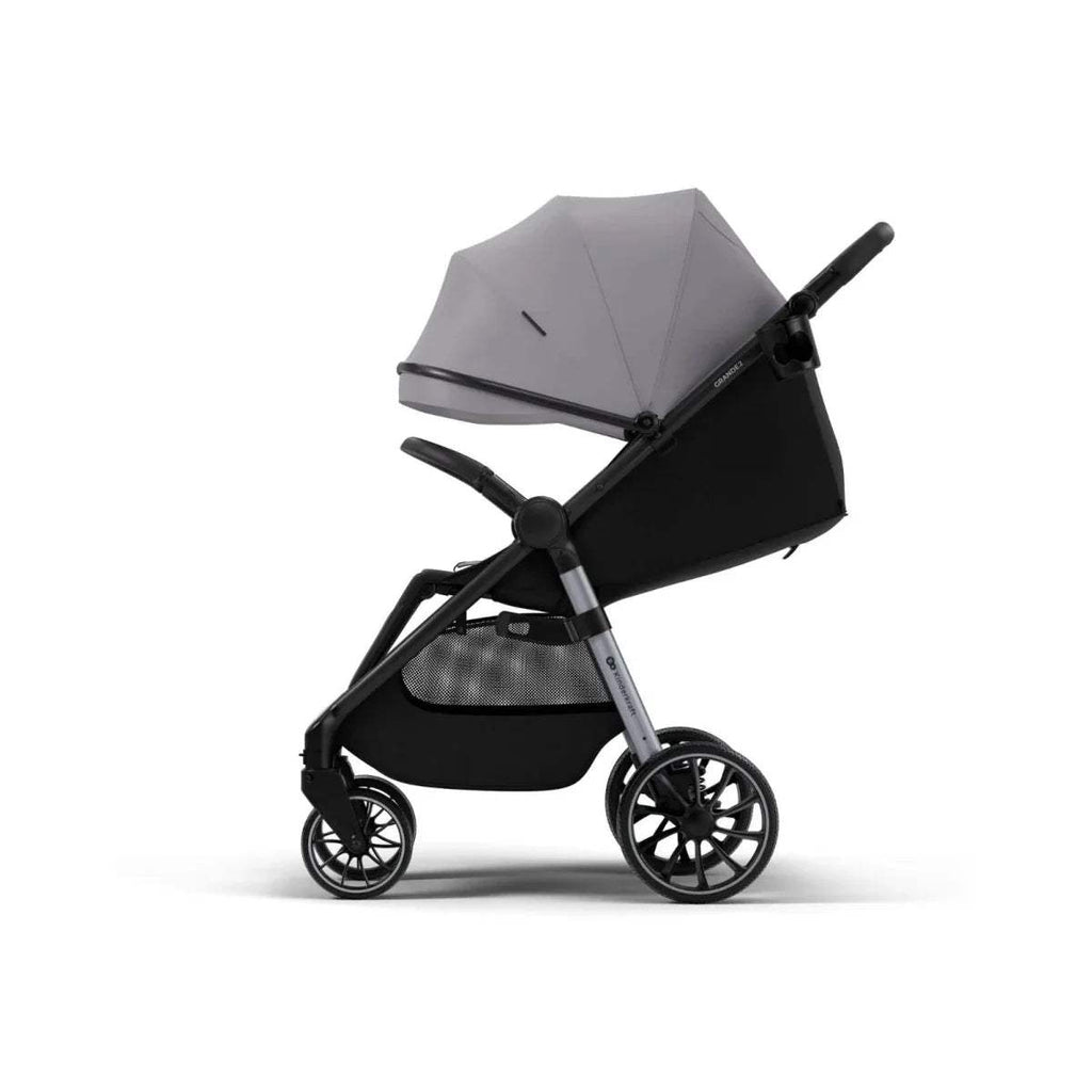 Grey stroller with black seat and canopy, side angle with front swivel wheels