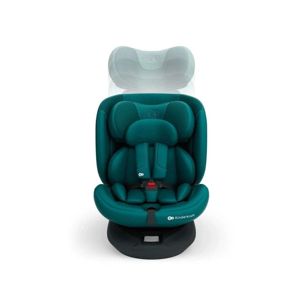 Green child car seat with padded insert and front harness buckle