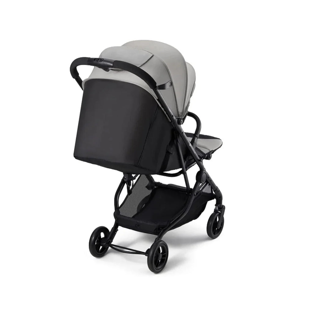 Grey stroller canopy over padded seat with black lower panel and storage basket