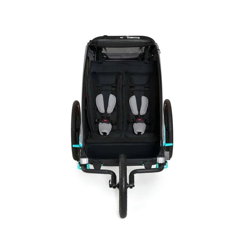 Turquoise and black 3-in-1 stroller rear view with two seats and safety harnesses