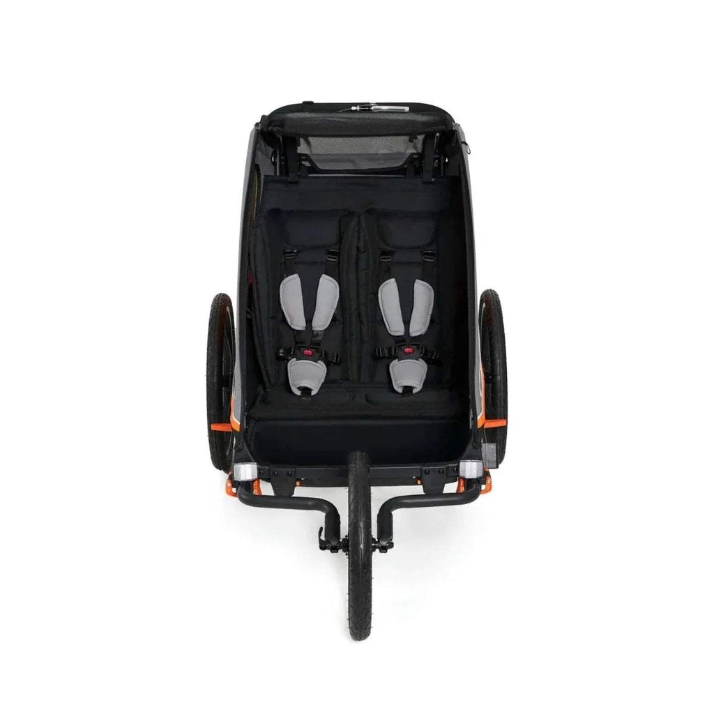Orange-and-black stroller seat interior with five-point harness and rear access