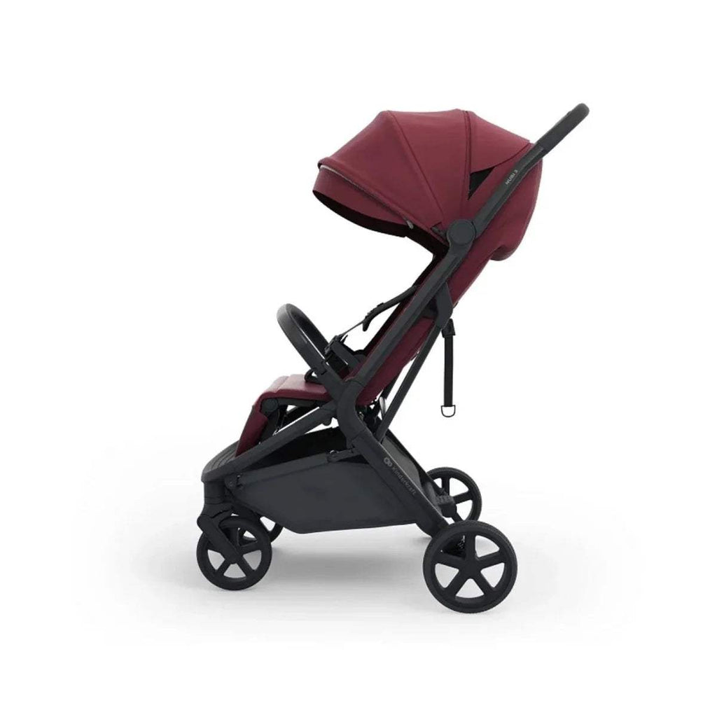 Dark ruby reclining stroller with black wheels, canopy, and footrest