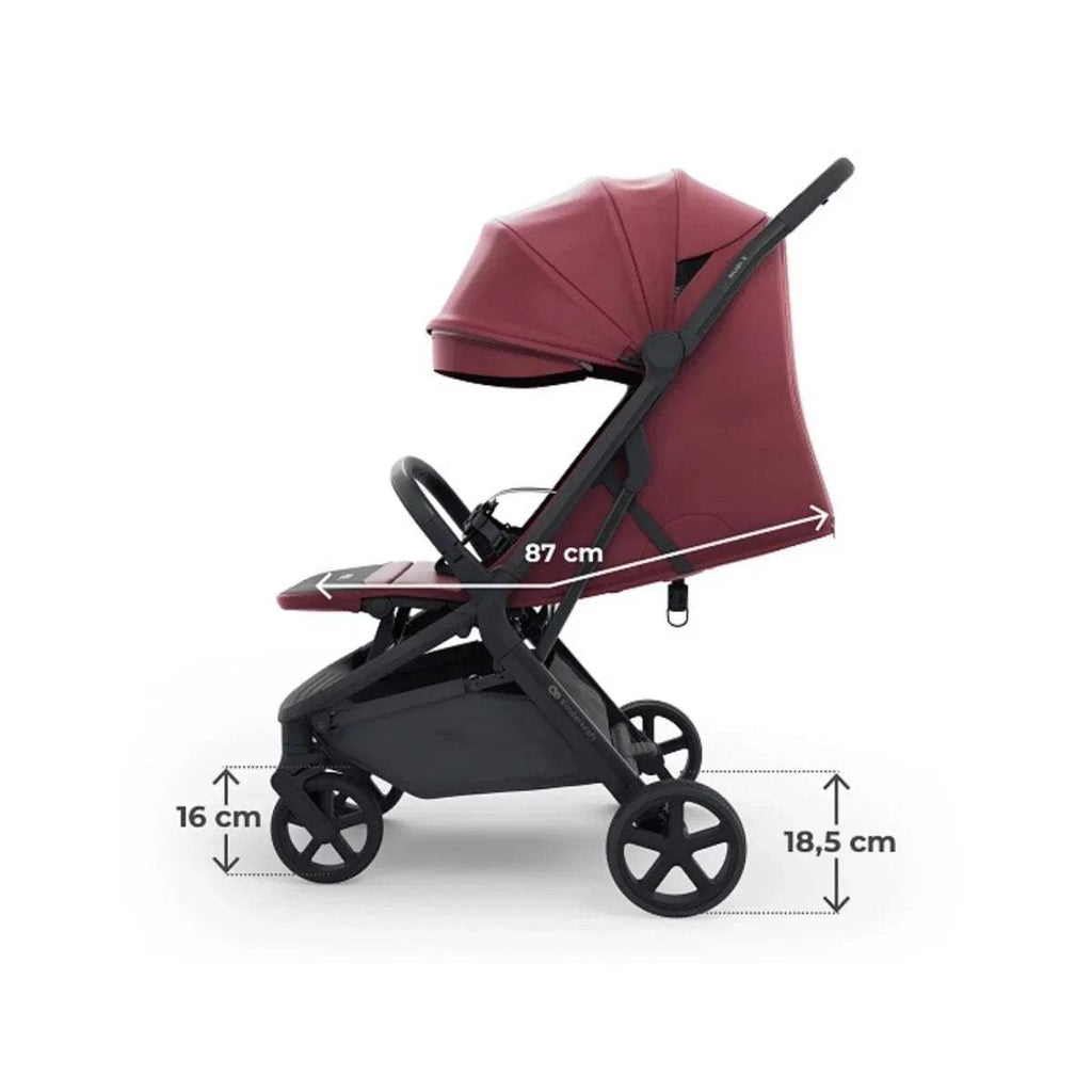 Dark ruby stroller with labeled dimensions, including 87 cm length and recline profile