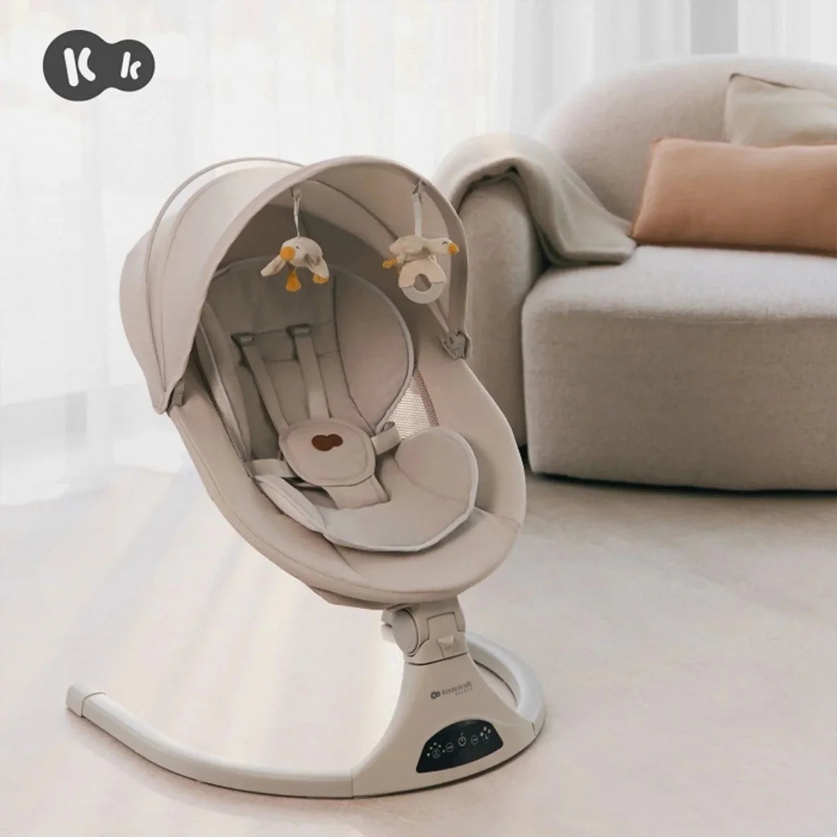 Grey baby swing seat with canopy and hanging toy arch over padded infant liner