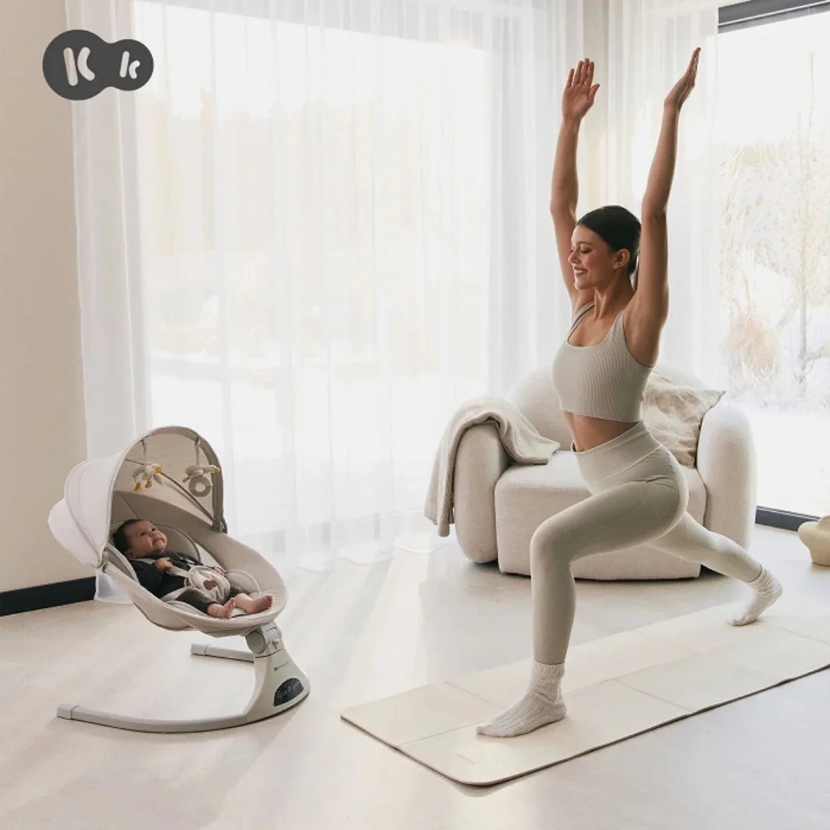 Grey baby swing chair with reclined seat and hanging toy arch