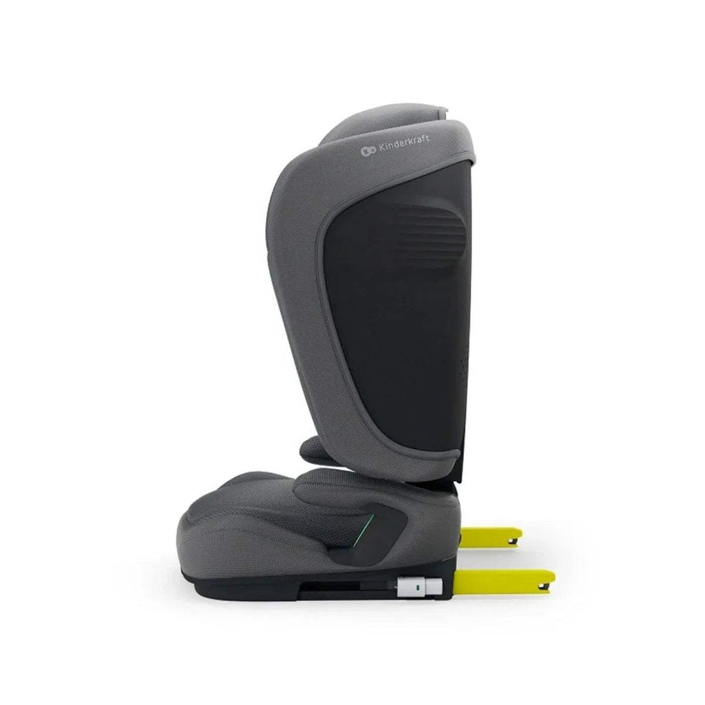Grey car seat with padded headrest, side wings, and dark belt guide panel