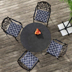 Set of navy blue seat cushion pillows with white trellis pattern; ties and rounded corners