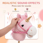 Pink plush unicorn stick horse showing pressed ear for sound, gold horn