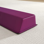 Close-up of purple padded end cap on folding gymnastics balance beam
