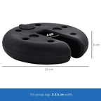 Black sand-fillable tent leg weight plate stack with several top and side holes