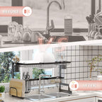 Black over-sink drying rack over a sink with shelves, hooks, and dish holders