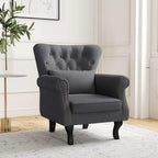 Dark grey Chesterfield-style accent chair with rolled arms and nailhead trim