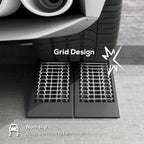 Black plastic car ramp with non-slip hex grid tread and open channel pattern