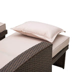 Brown rattan sofa lounger with beige seat pad and pillow for reclining comfort