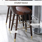 Brown PU leather bar stool with footrest and solid wood legs with gold accents
