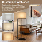 Black floor lamp with beige fabric shade and three open shelves