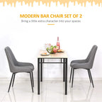 Grey upholstered dining chair set of 2 with quilted backs and black metal legs