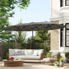 Dark grey patio sun umbrella over outdoor sofa set in a yard
