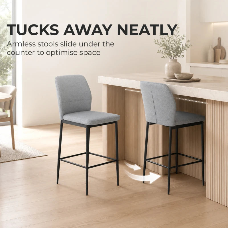 Grey velvet bar stool with backrest and footrest, black metal frame