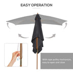 Dark grey parasol with rope pulley close mechanism on the wooden pole