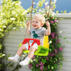 Kids swing seat in green, yellow, and red with rope; child seated and belted
