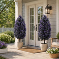 Set of 2 artificial lavender plants with purple blooms in white pots on outdoor porch