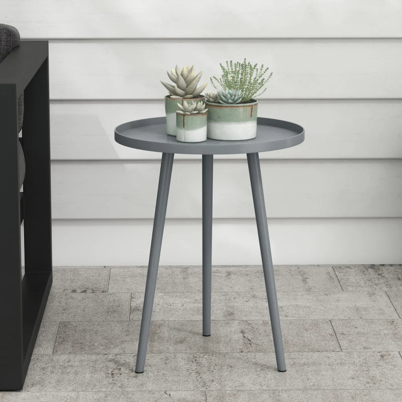 Grey round side table with circular top and tapered steel legs, clean modern design