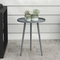 Grey round side table with circular top and tapered steel legs, clean modern design