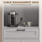 Grey pantry cabinet with cable management hole for appliance cords