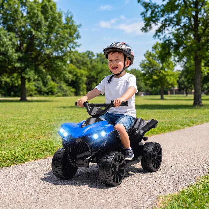 Blue kids electric ATV with LED headlights, ridden by a child wearing a helmet