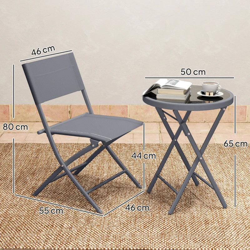 Grey folding chairs and round glass-top bistro table shown with size measurements