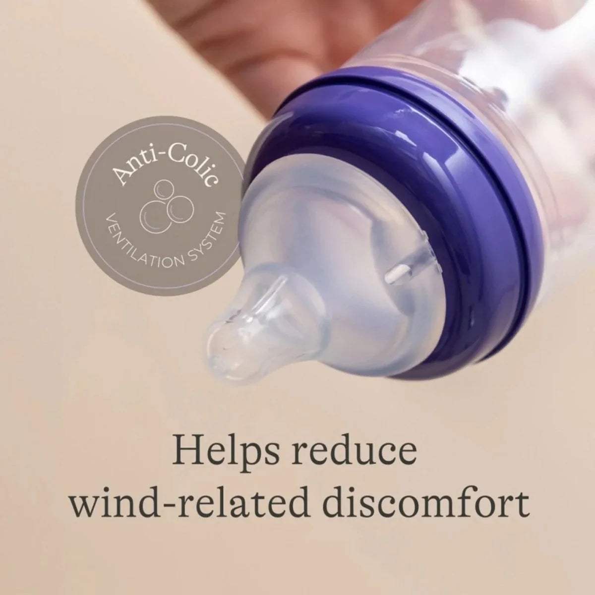 Anti-colic bottle teat close-up, clear nipple with blue vented base