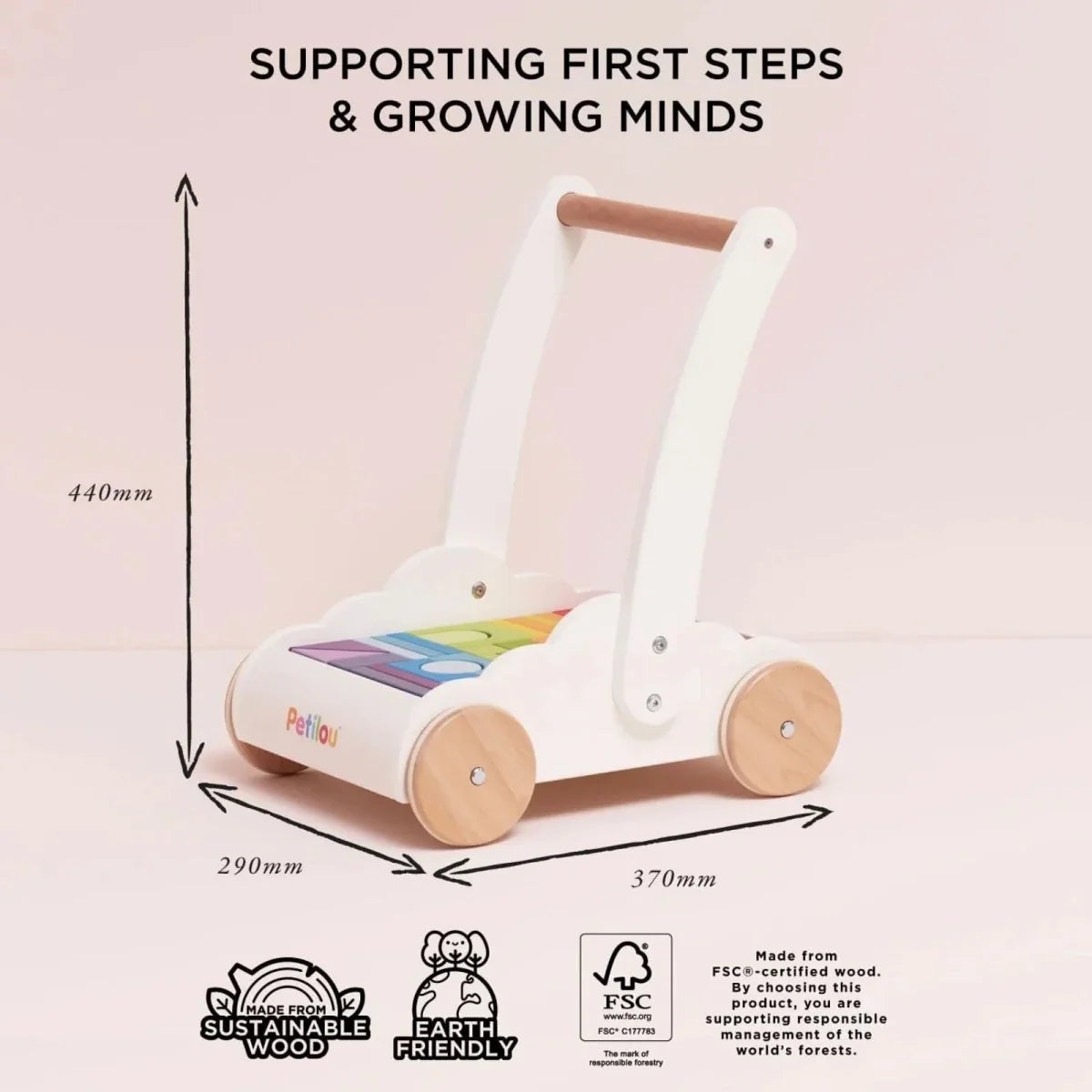 White wooden baby walker with shape tray and multicolored block set