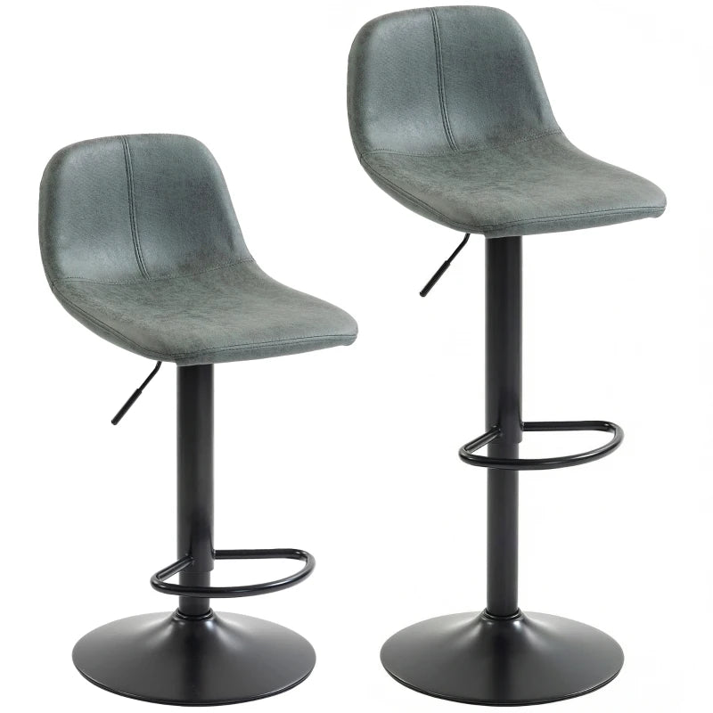 Set of 2 green swivel bar stools with curved upholstered seats and metal pedestal bases