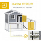 Grey two-tier rabbit hutch with multiple entry doors, ramp, and wire enclosure