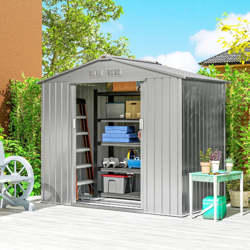 Light grey metal garden storage shed with open double doors and shelves inside.